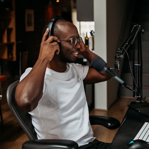 A man speaking on a podcast recording