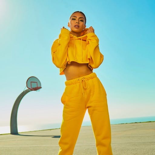 a yellow fashionable hoodie on a woman